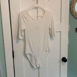 Cream body suit. Soft and stretchy.